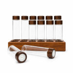 Funnel filling glass dosing tube with coffee beans